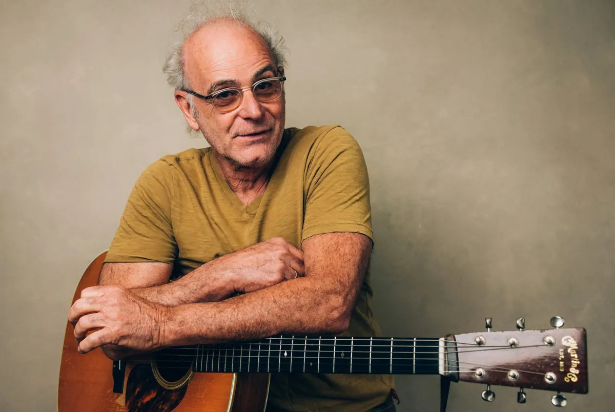 Ed Snodderly, songwriter, seated with his guitar, performer at Bristol Sessions Nights in Bristol, Tennessee