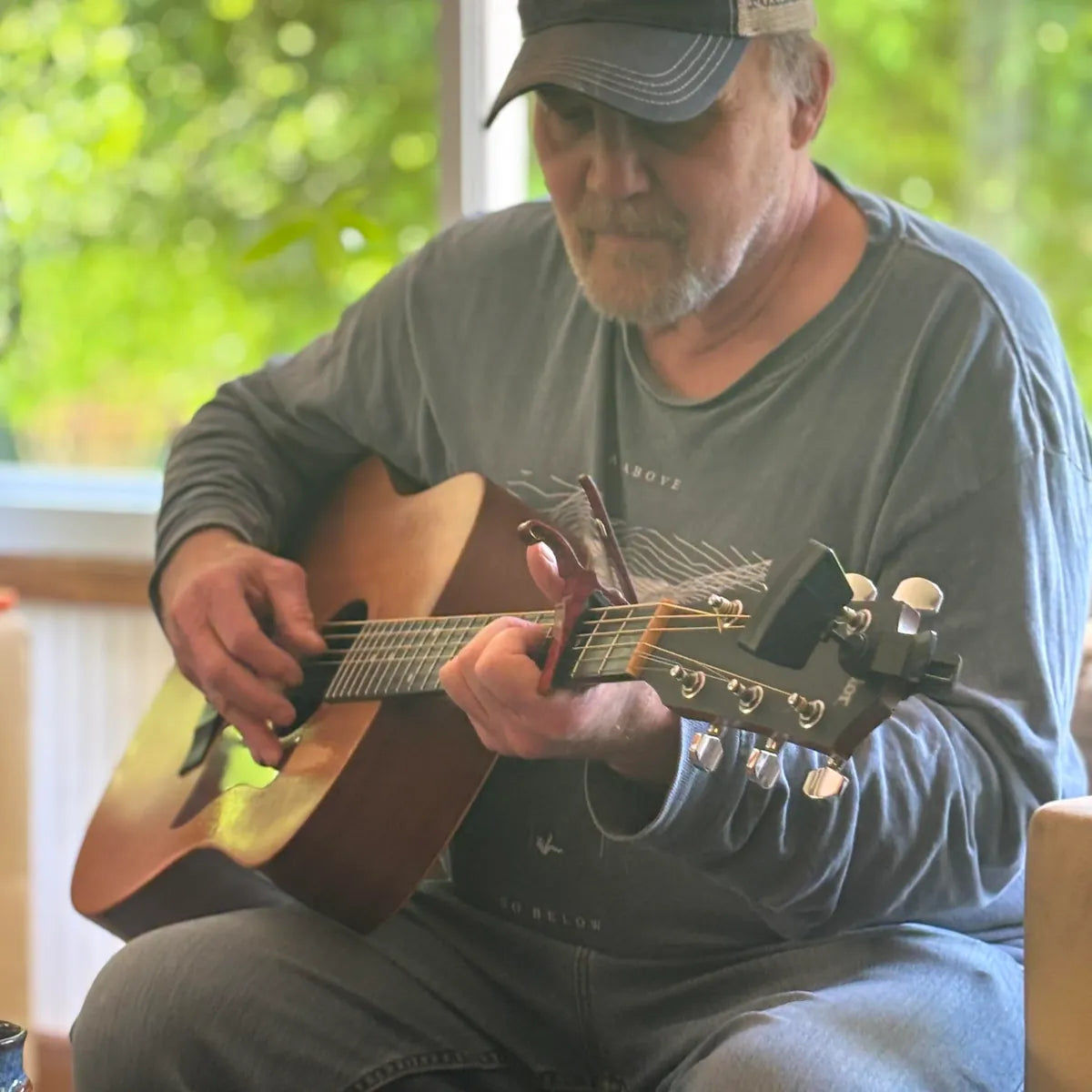 Eugene Wolf playing acoustic guitar, storyteller and singer at Bristol Sessions Nights: The Carter Sessions in Bristol, Tennessee