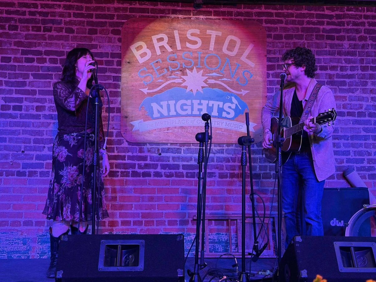 Logan & McKenna performing as a duo under purple stage light at Bristol Sessions Nights: The First Take, Bristol Listening Room, L.C. King Building, Bristol, Tennessee