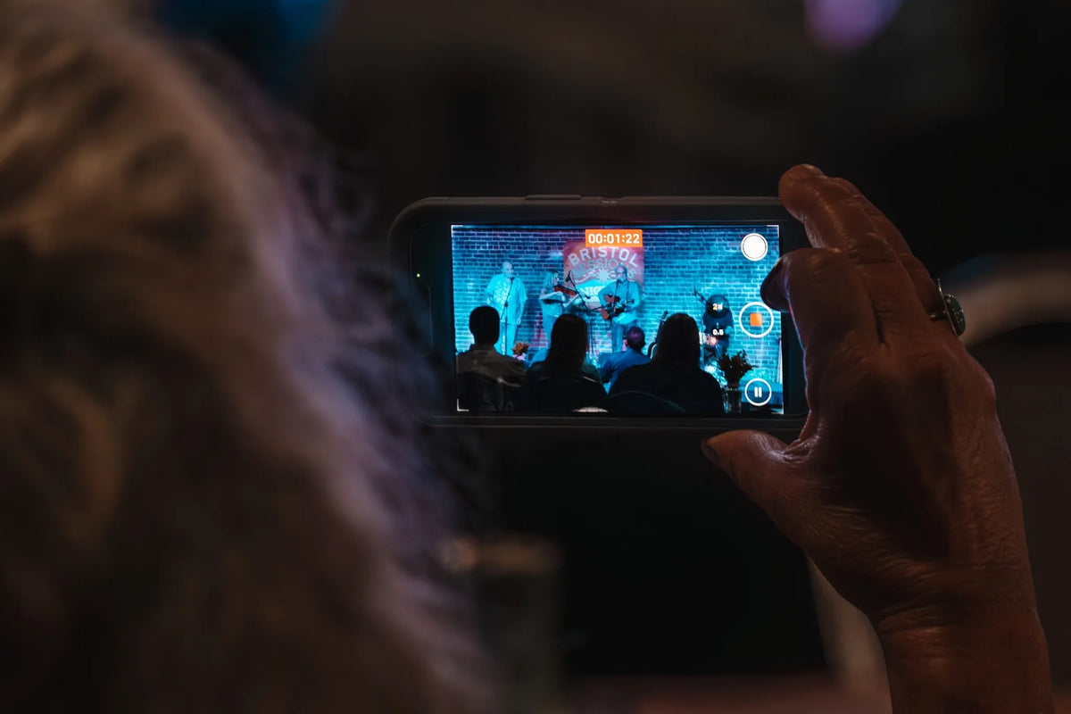 A guest records the performance on a phone at Bristol Sessions Nights: The First Take, Bristol Listening Room, L.C. King Building, Bristol, Tennessee
