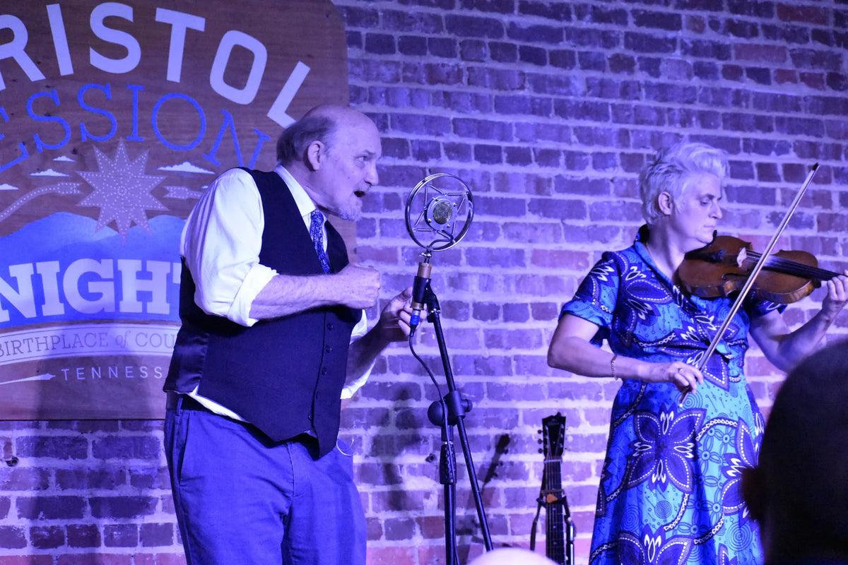 An old-time duo on stage, one singing while the other plays fiddle at Bristol Sessions Nights: The Carter Sessions, Bristol Listening Room, L.C. King Building, Bristol, Tennessee