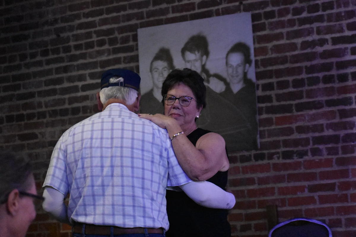 A couple dances beside the brick wall during the show at Bristol Sessions Nights: The Carter Sessions, Bristol Listening Room, L.C. King Building, Bristol, Tennessee