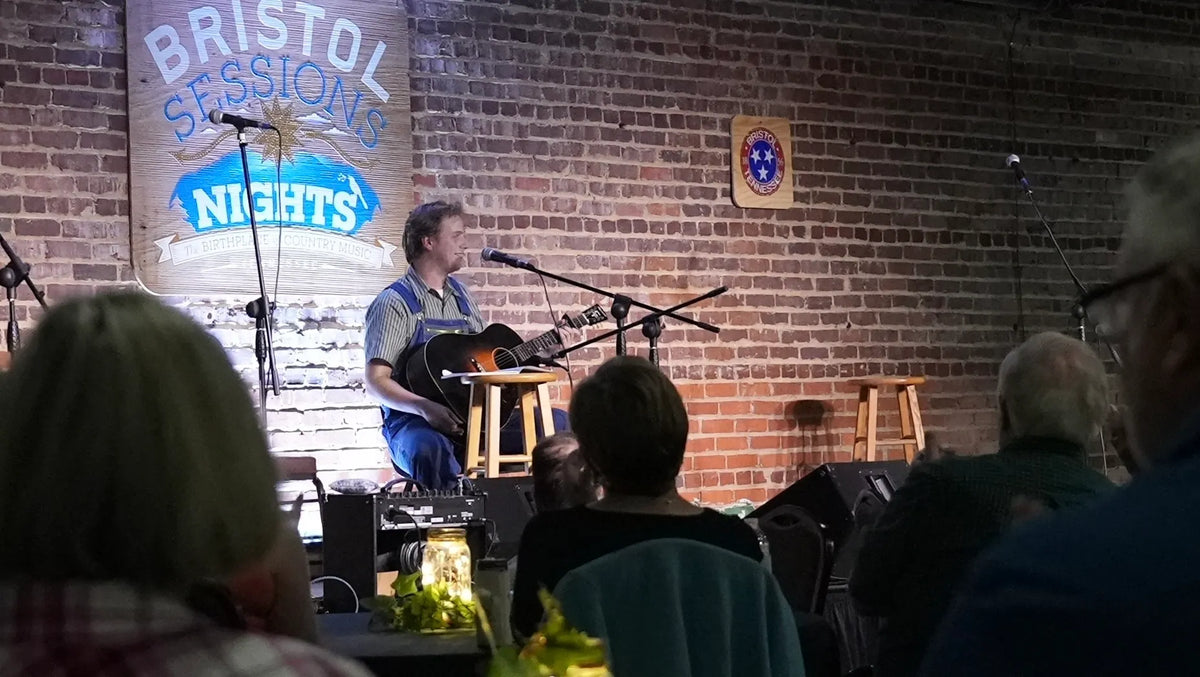 Conner Vlietstra performing for a seated audience at Bristol Sessions Nights: The Blue Yodel, Bristol Listening Room, L.C. King Building, Bristol, Tennessee