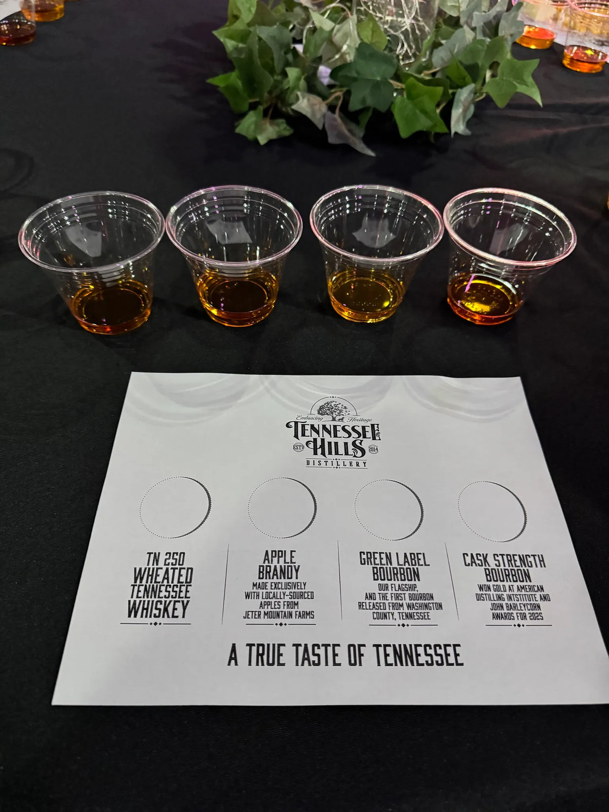 A Tennessee Hills Distillery whiskey flight with a True Taste of Tennessee tasting card at Bristol Sessions Nights: A True Taste of Tennessee, Bristol Listening Room, L.C. King Building, Bristol, Tennessee