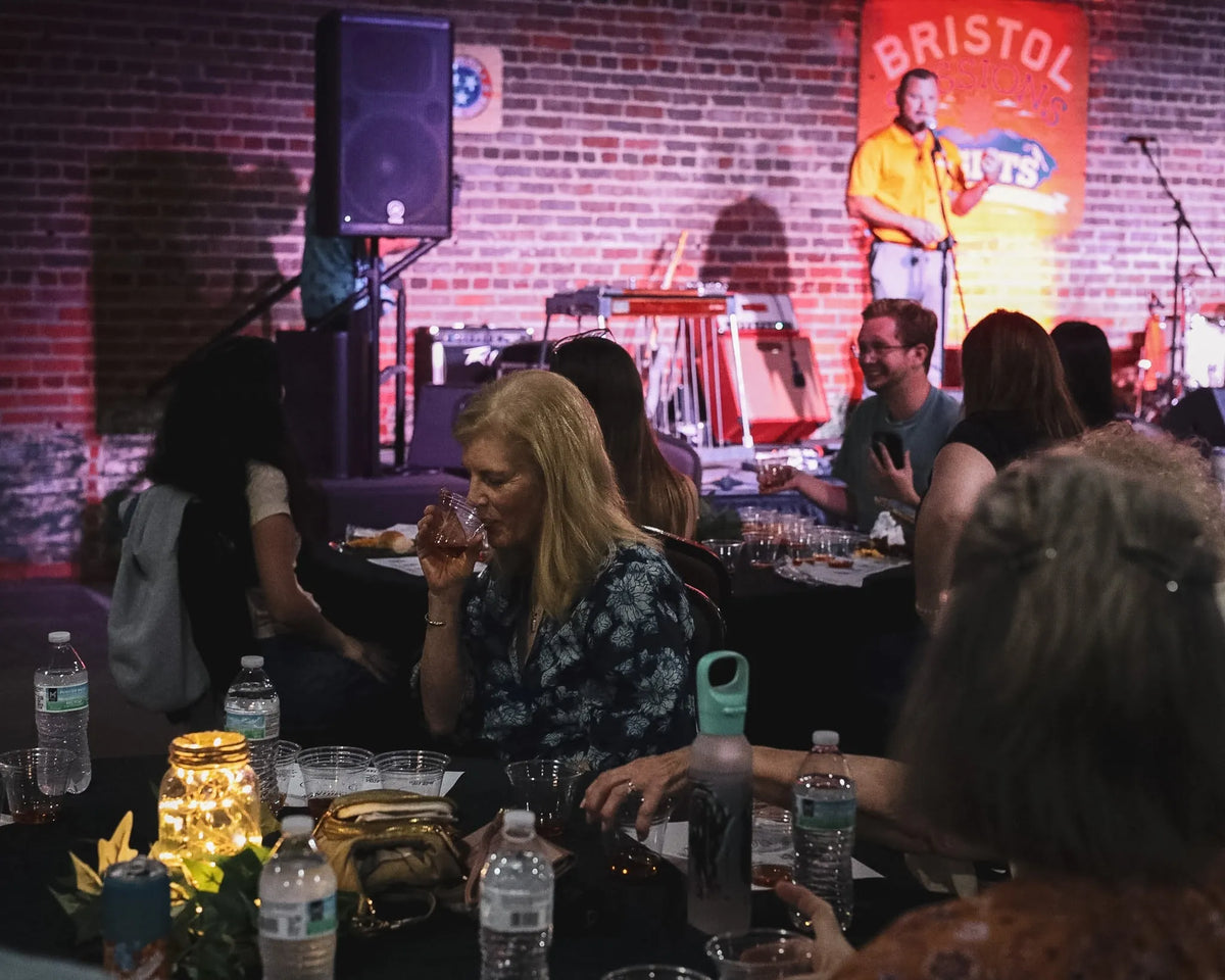 Guests sample whiskey pours at their table during the show at Bristol Sessions Nights: A True Taste of Tennessee, Bristol Listening Room, L.C. King Building, Bristol, Tennessee