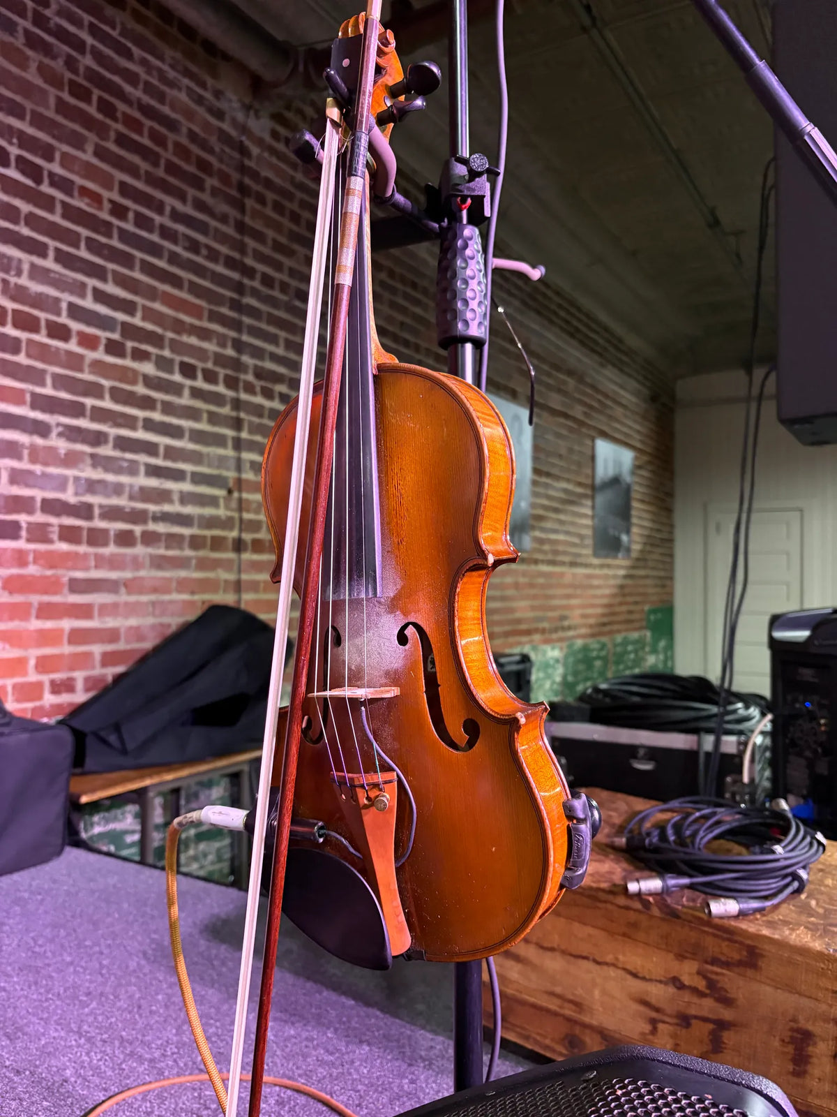 A fiddle and bow resting on a stand before the show at Bristol Sessions Nights: A True Taste of Tennessee, Bristol Listening Room, L.C. King Building, Bristol, Tennessee